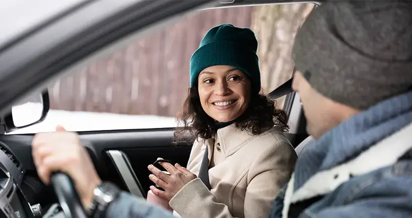 Driving instructor from MA Driving School explaining speed limit signs to a learner driver during a road safety lesson.